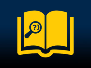 A magnifying glass on an open book